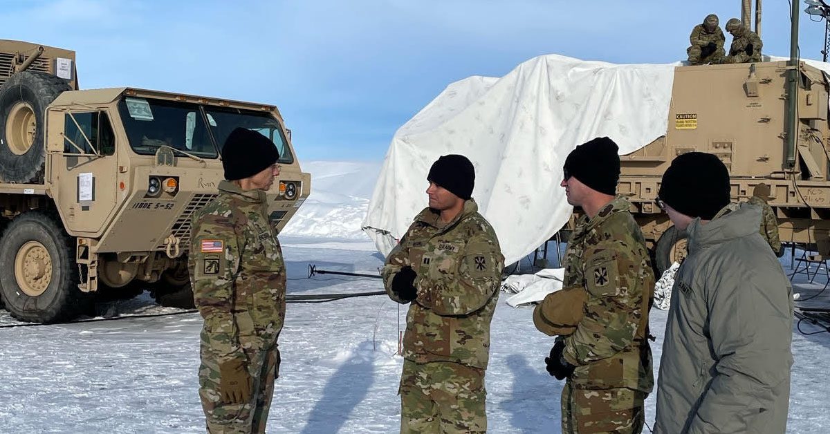 Maj. Gen. Susan Henderson (left), commanding general of the 377th Theater Sustainment Command, discusses communications capabilities during a theater tour of Exercise Arctic Edge 2022 (AE22) at Eielson Air Force Base, Alaska, March 9, 2022. AE22 is a biennial exercise that involved approximately 1,000 participants, including U.S. and Canadian service members, U.S. Coast Guardsmen, and government employees from the U.S. Department of Defense and Canada's Department of National Defence. (U.S. Army photo by Capt. Mary Dempsey)